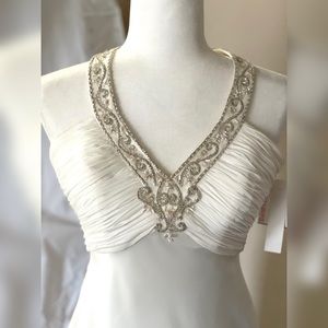 Beaded Halter style David’s Bridal wedding dress Size 2. Color: Ivory
